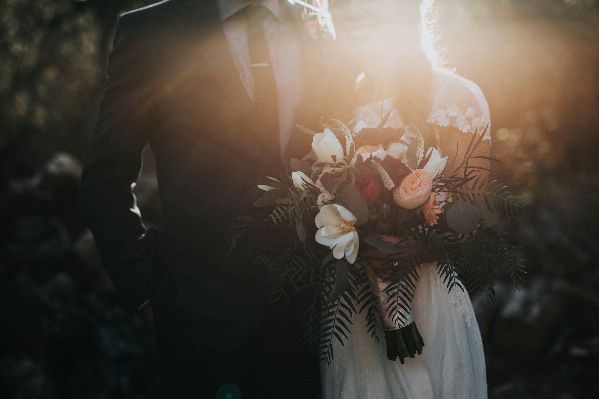 Bride in white dress holding bridal bouquet